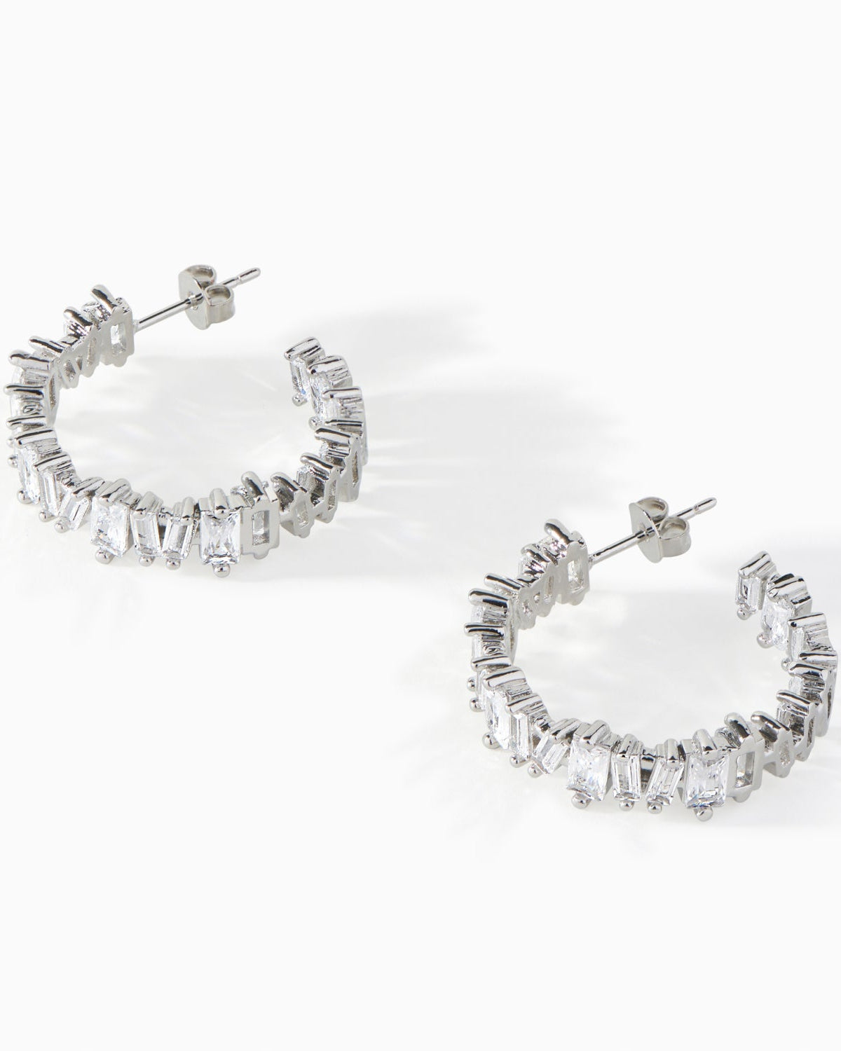 Detail of the baguette cut white CZ stones on the Ora Ana Clarity Hoop Earrings