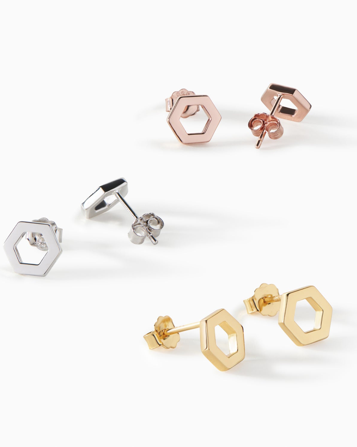 All three Ora Ana Helena Stud Earring finishes shown together