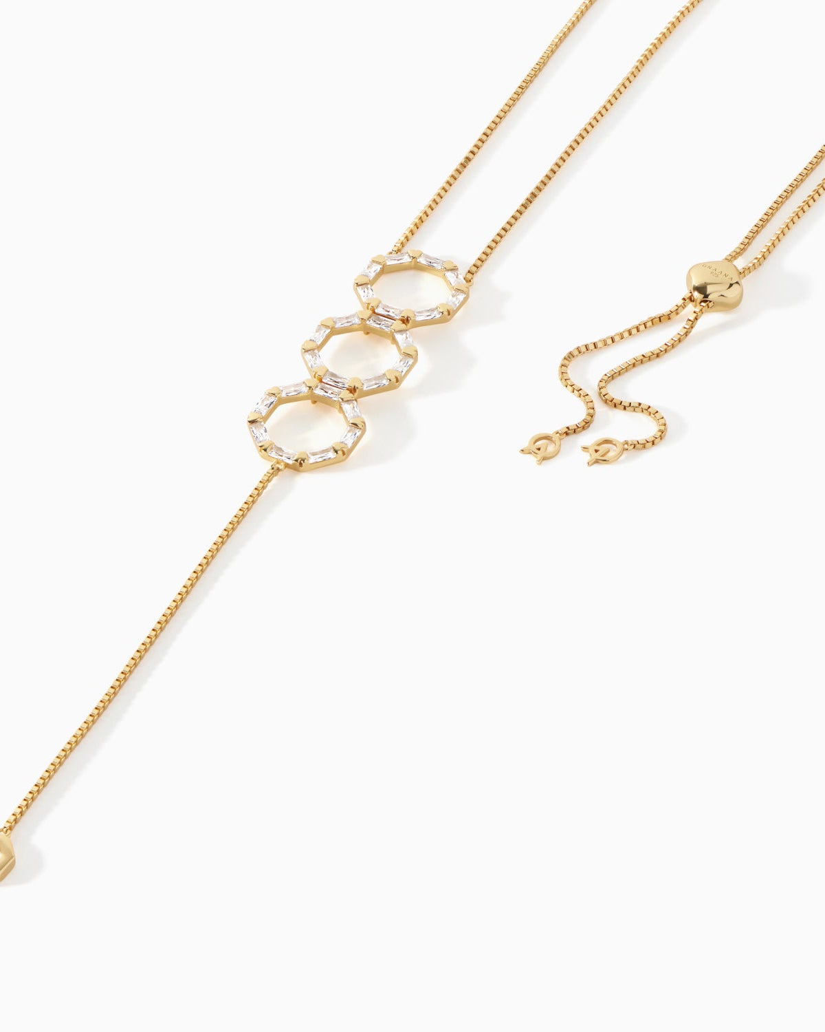 Detail of the baguette studded hexagon pendants on the gold vermeil Stella Lariat