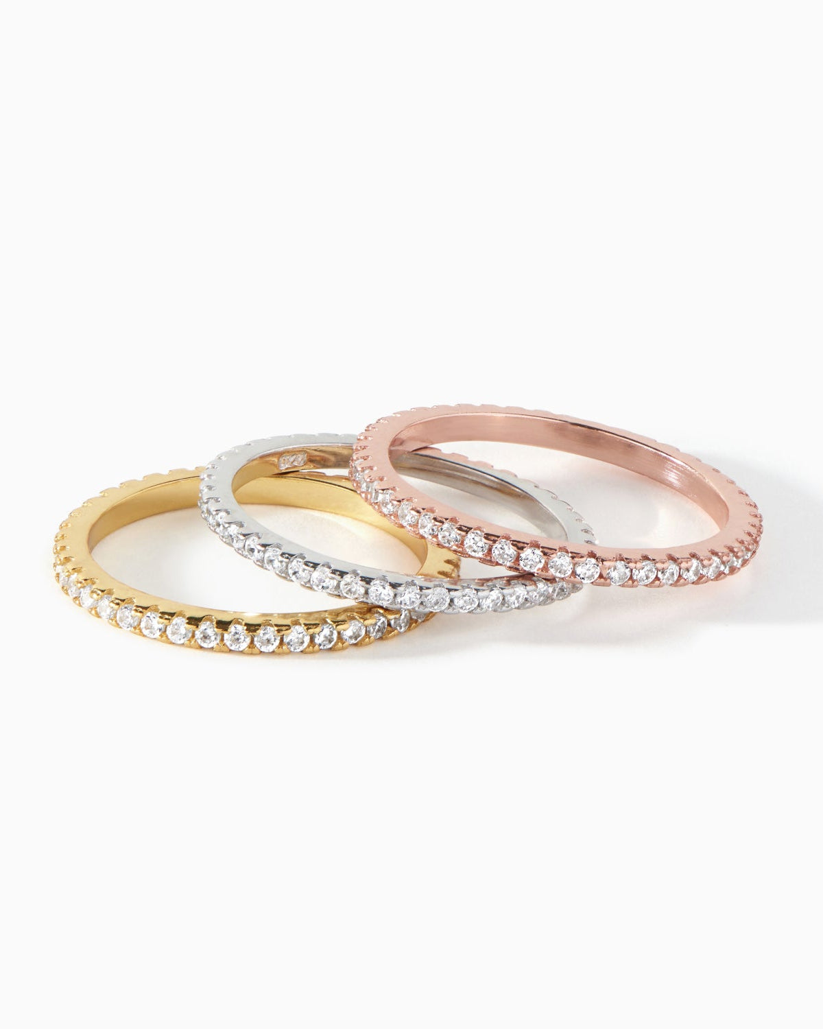 Ora Ana Isla Ring, a slim stackable band set with a row of CZ stones