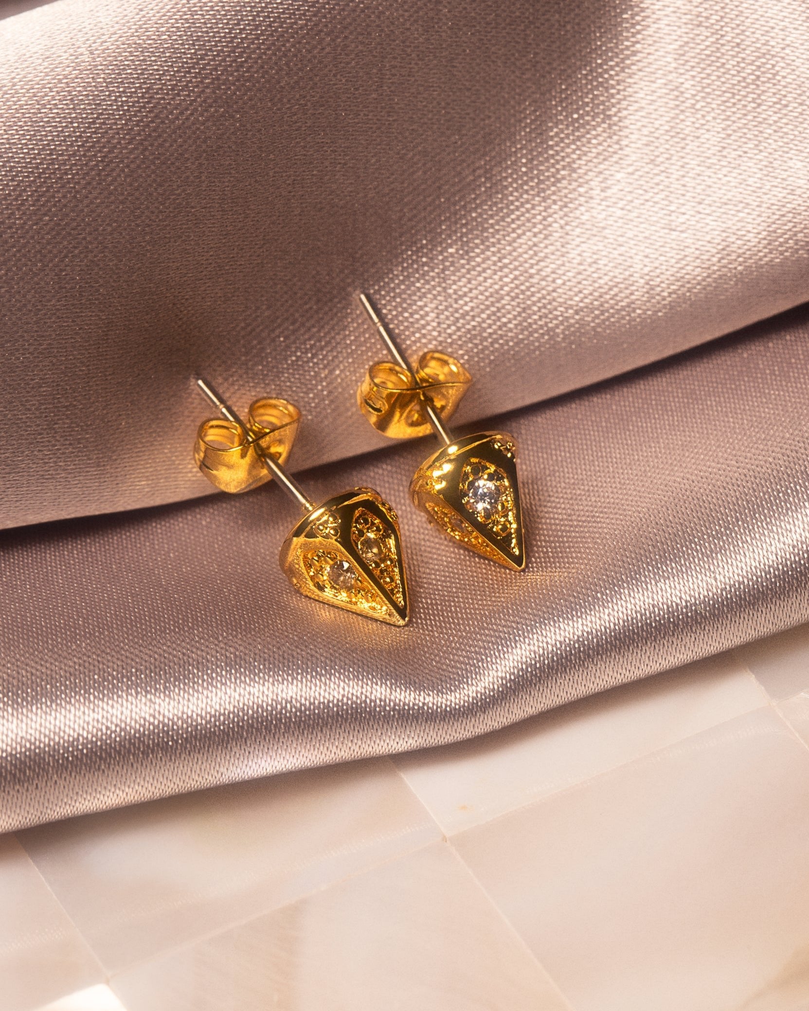 Ora Ana Dagger Studs styled in an editorial portrait crop