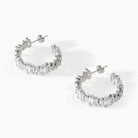 Detail of the baguette cut white CZ stones on the Ora Ana Clarity Hoop Earrings