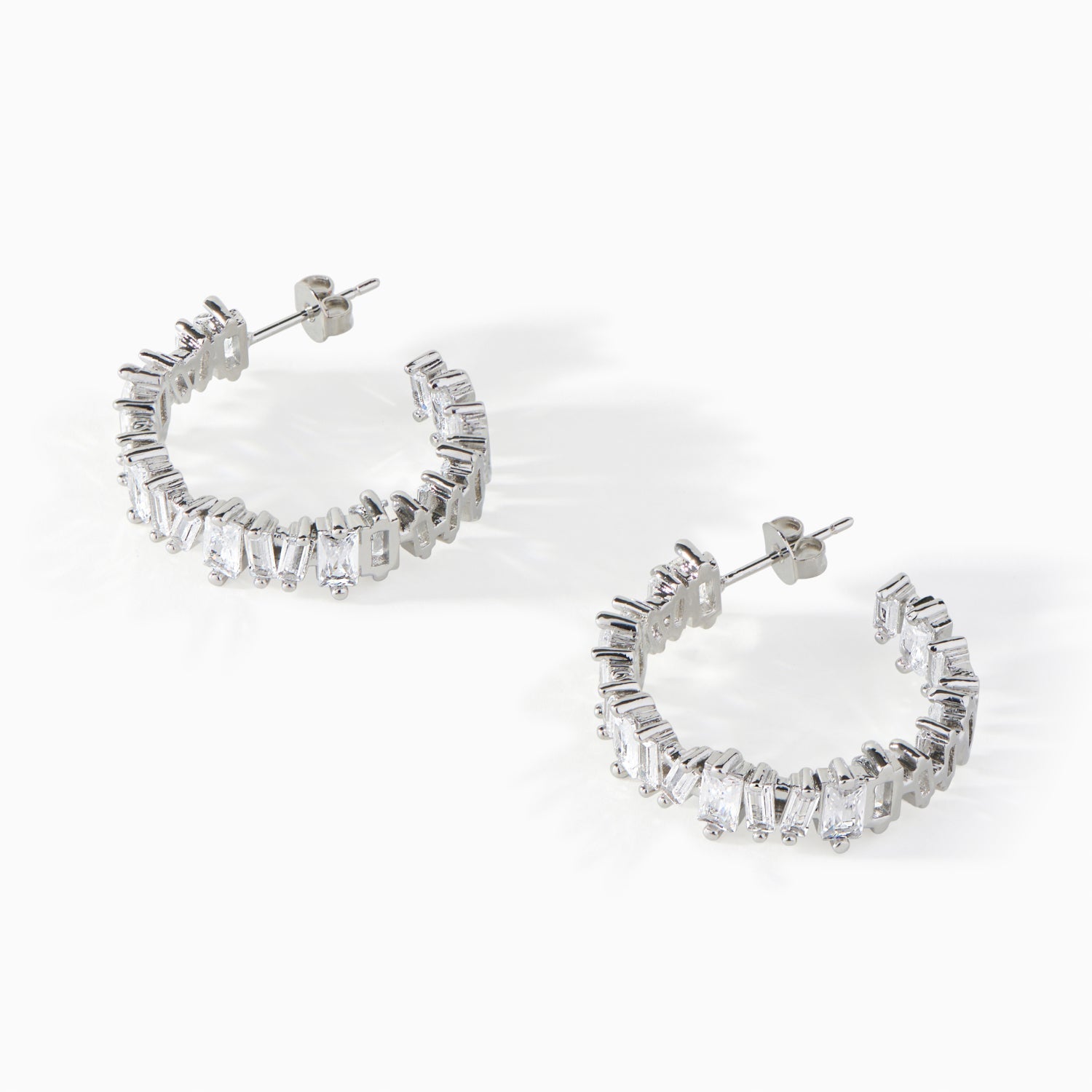 Detail of the baguette cut white CZ stones on the Ora Ana Clarity Hoop Earrings