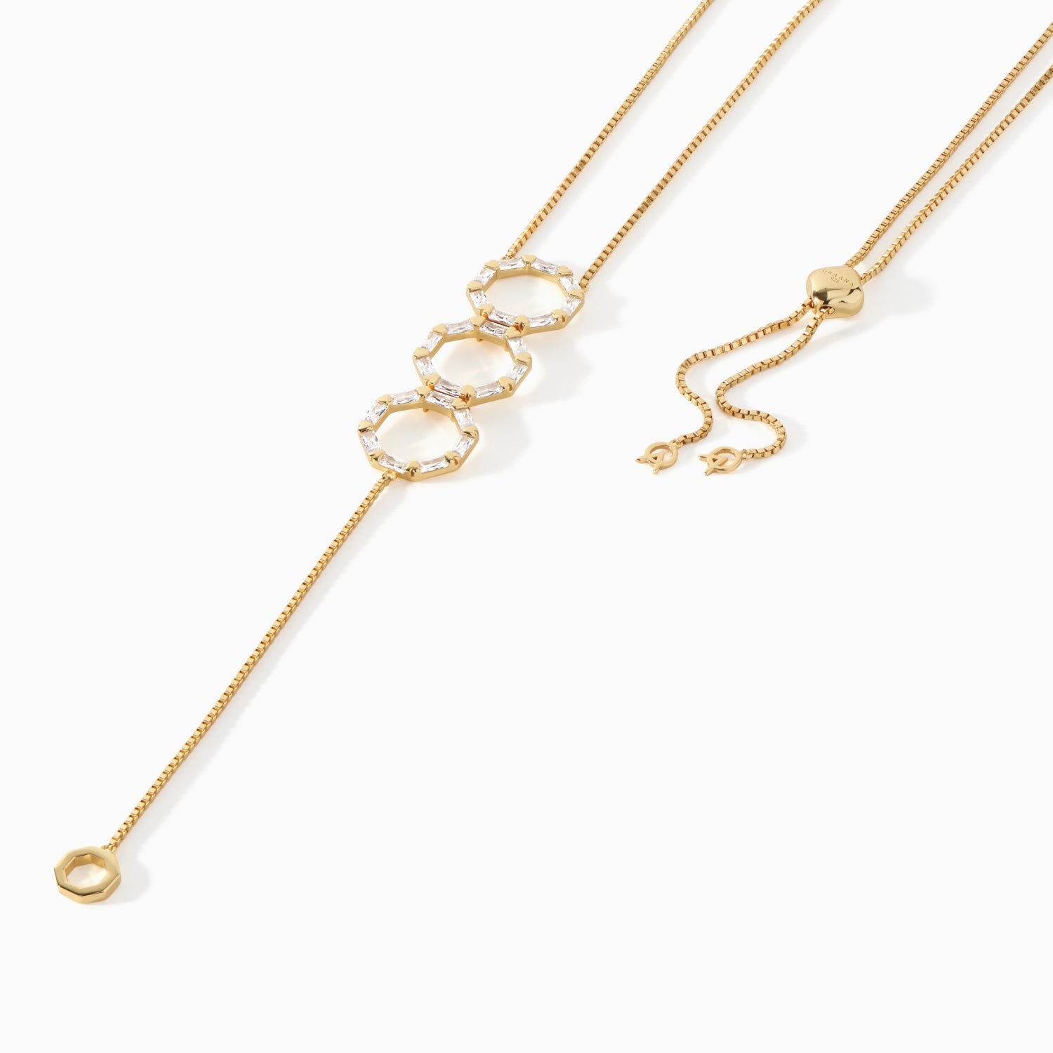 Detail of the baguette studded hexagon pendants on the gold vermeil Stella Lariat