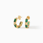Claire Huggie Hoops in gold vermeil with emerald CZ from Ora Ana