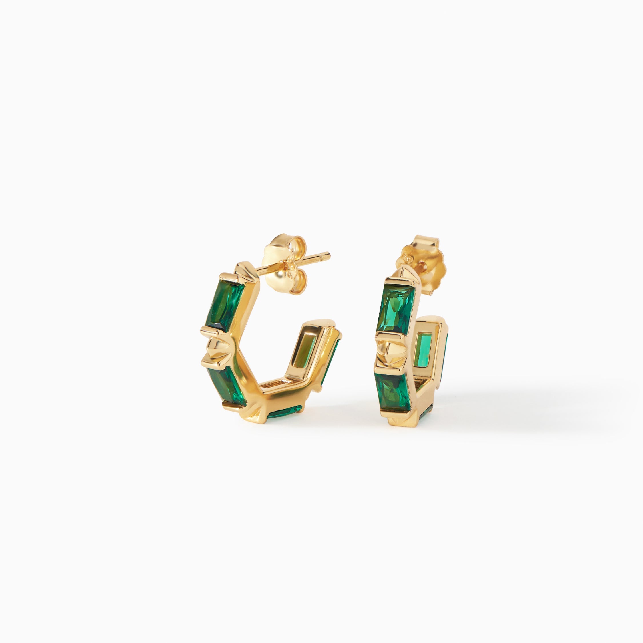 Claire Huggie Hoops in gold vermeil with emerald CZ from Ora Ana