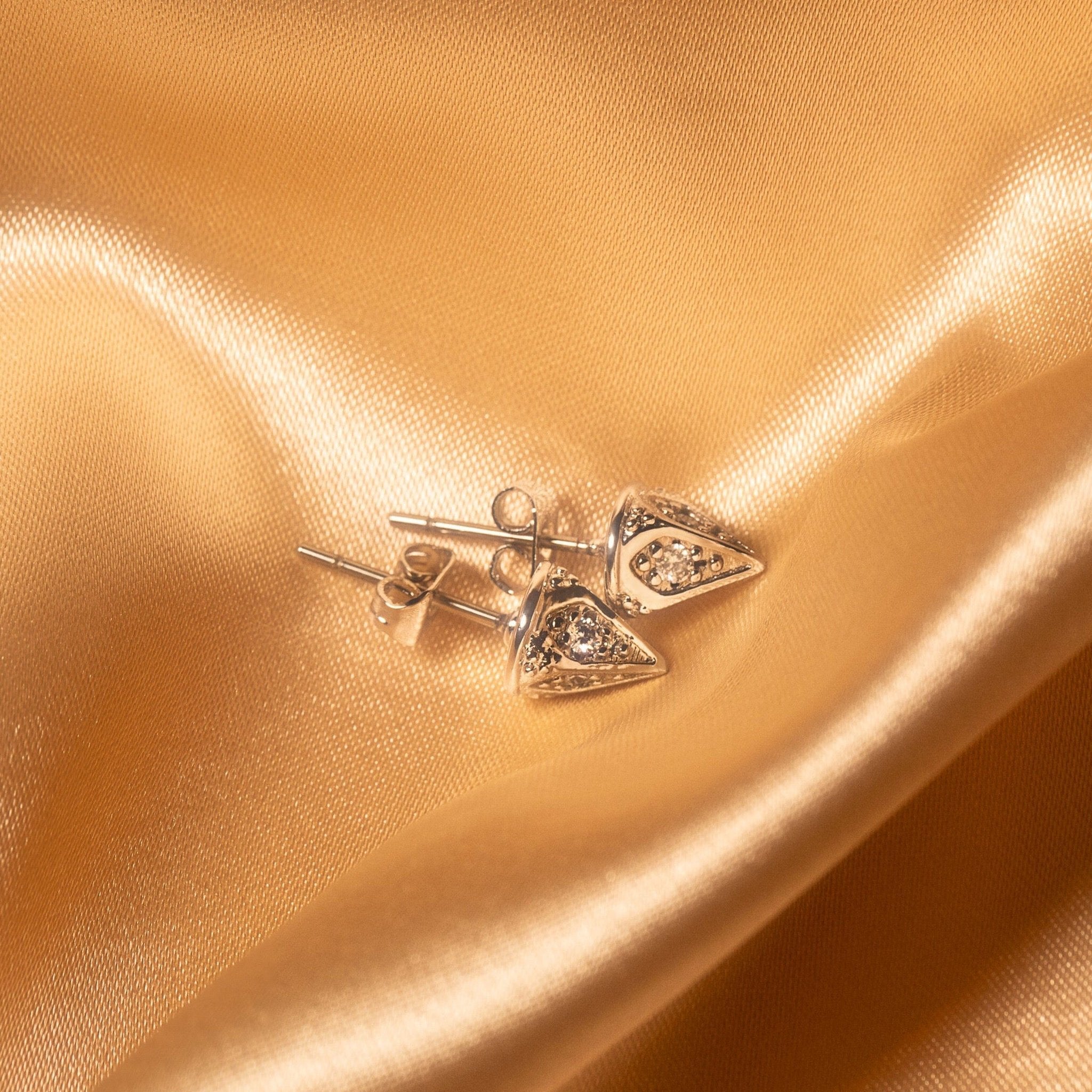Ora Ana Dagger Stud Earrings shown close to the ear