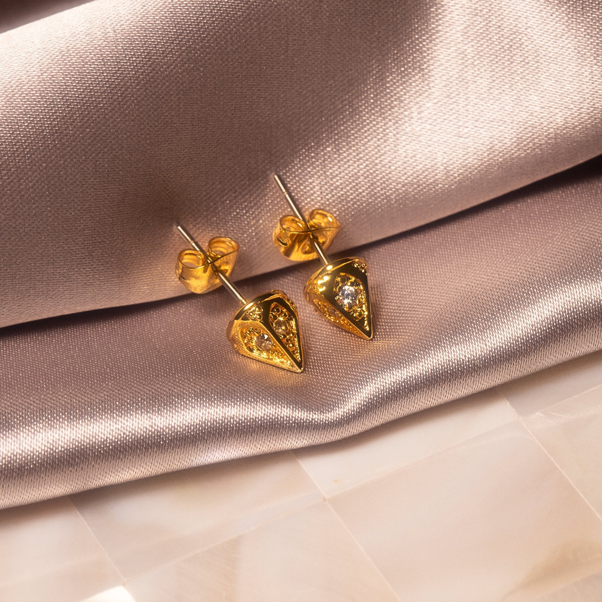 Ora Ana Dagger Studs styled in an editorial portrait crop